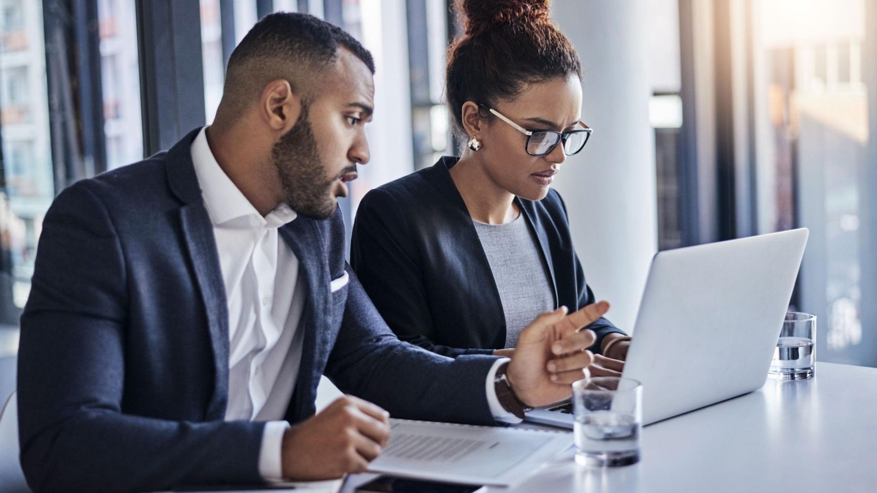 Cybersecurity experts collaborating to design a compliant security program